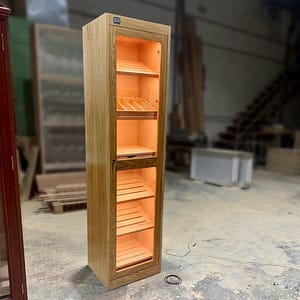 Tailor made humidor with almost two meters high, finished in cherry wood. With natural humidification system (tray with sponge). Cold led light to illuminate the interior, made with cedar wood. With Latvia destination.